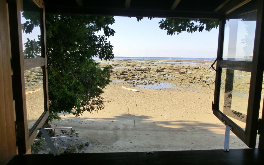 View from cafe window. The beach is visible at low tide.